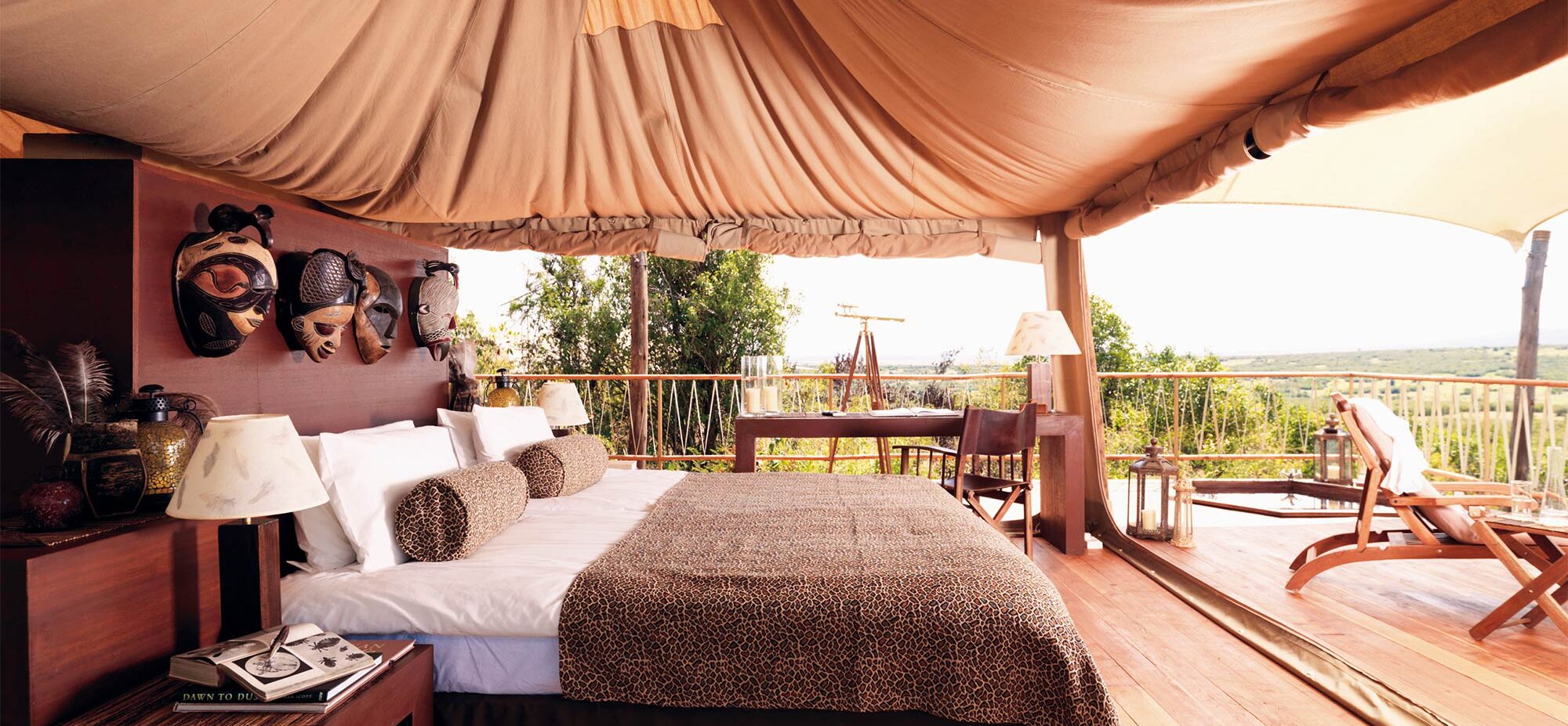 A bed in the middle of the tent