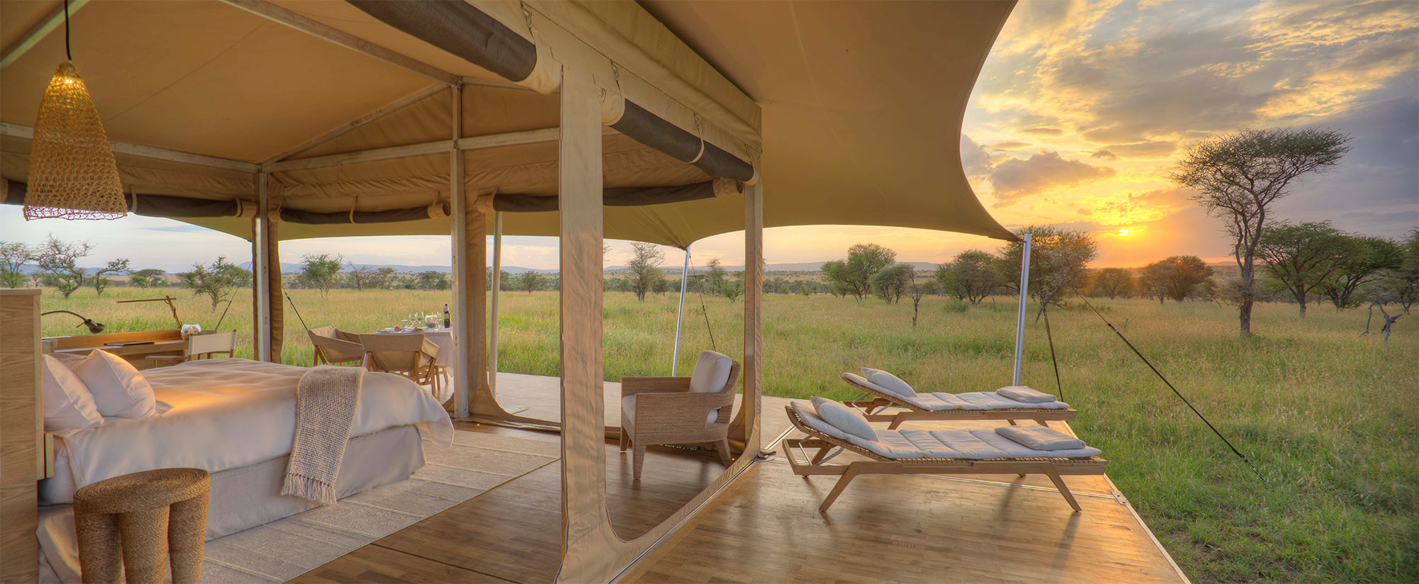 Two lounge chairs on the deck with the Serengeti in the background