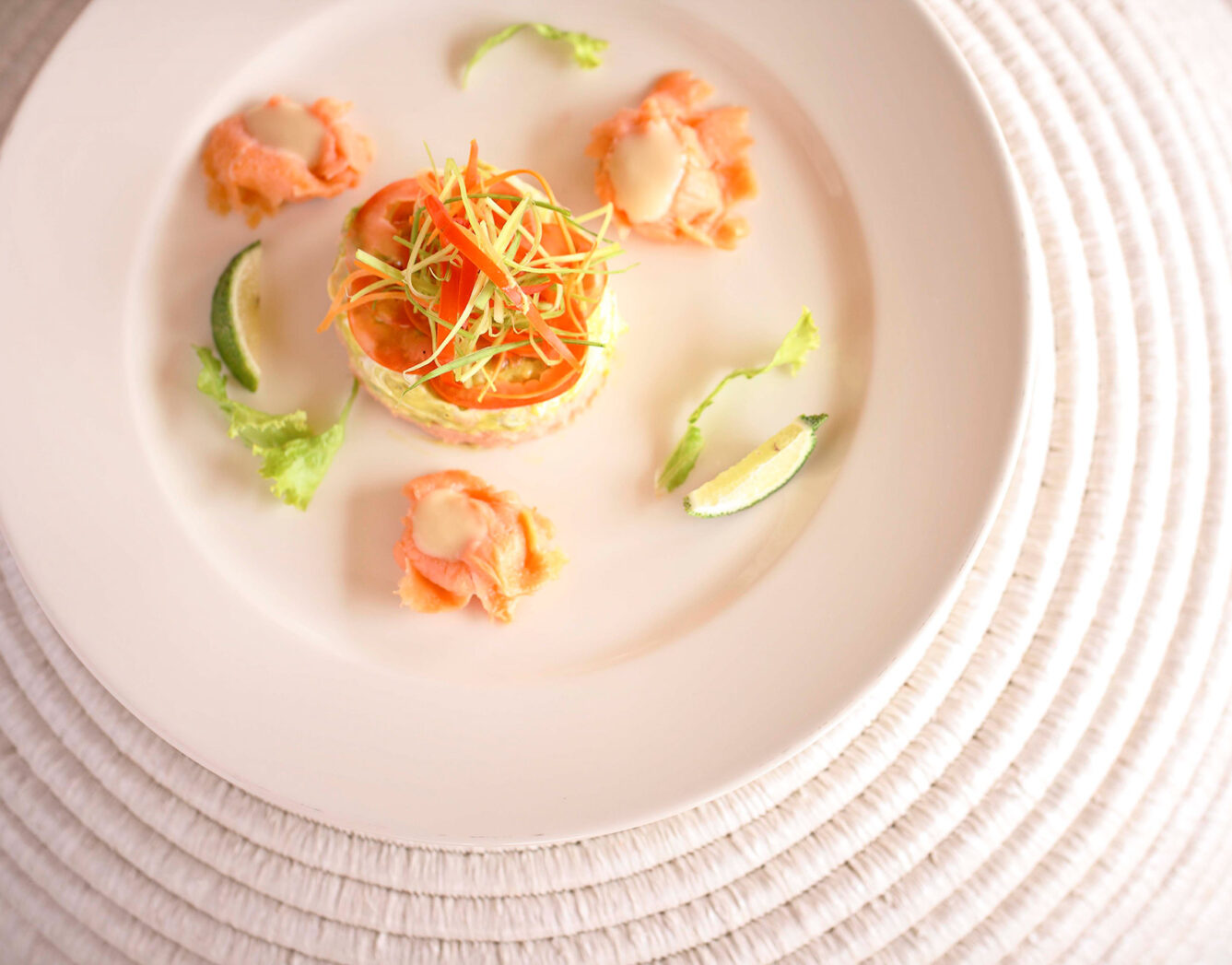 An appetizer of vegetables served on a white plate