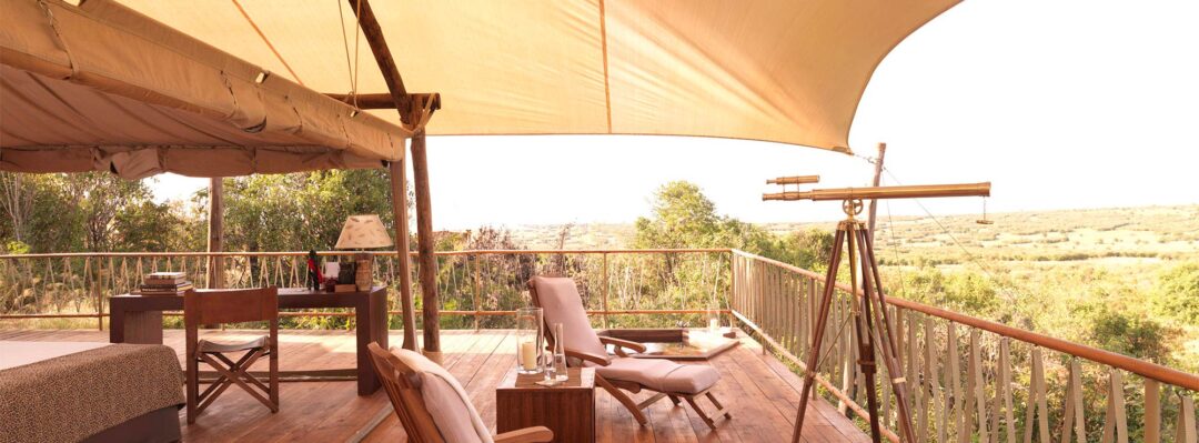 Two chairs on the tent deck looking at the sunrise