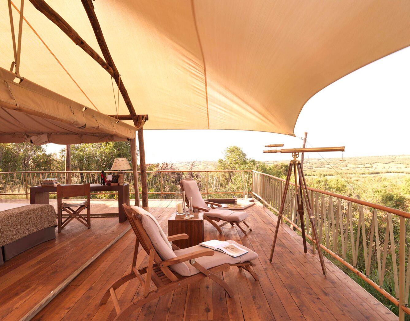 Two chairs on the tent deck looking at the sunrise