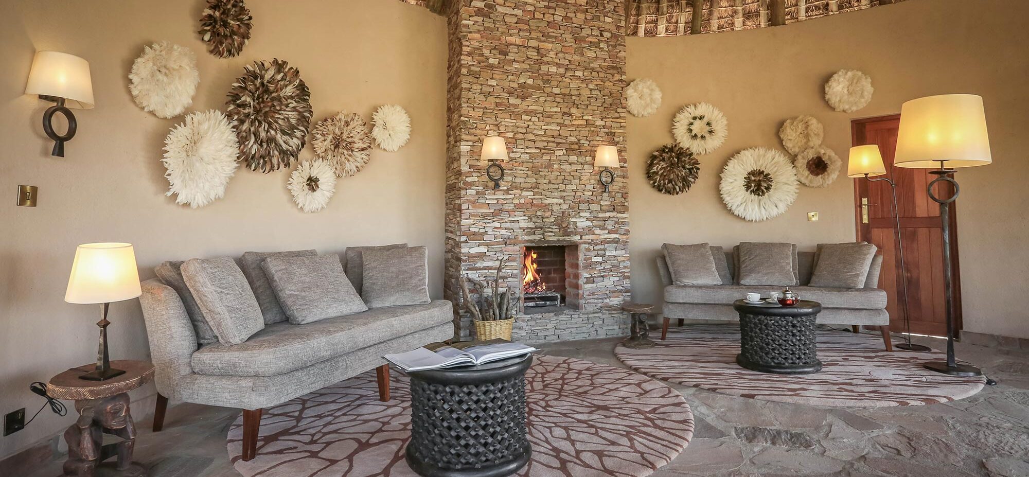 Fire place in the middle of a sitting room