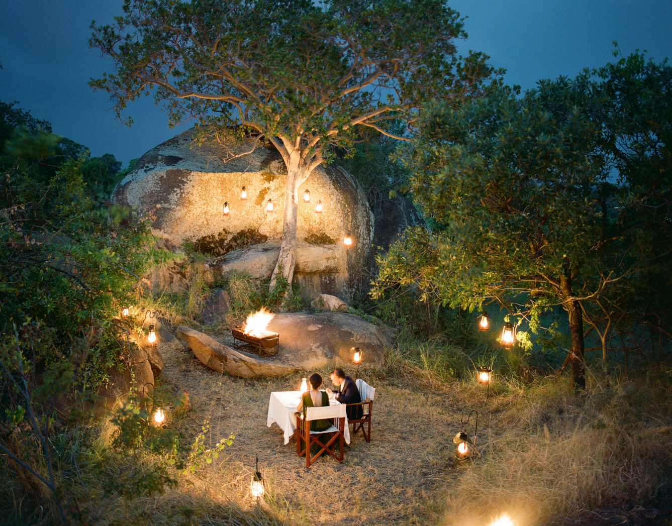 Couple dining outdoors at night