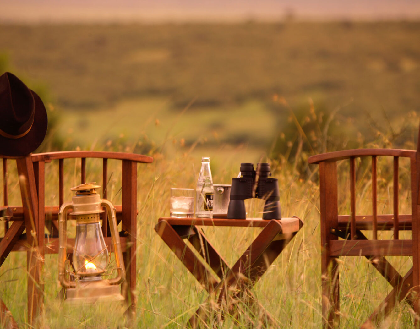 Chairs and a table with binoculars setup to watch the sunset