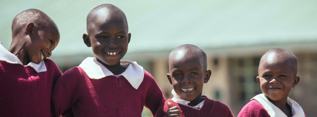 Four school children in uniform