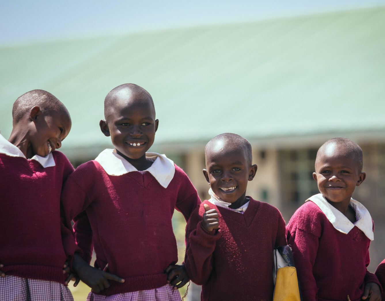 Four school children in uniform