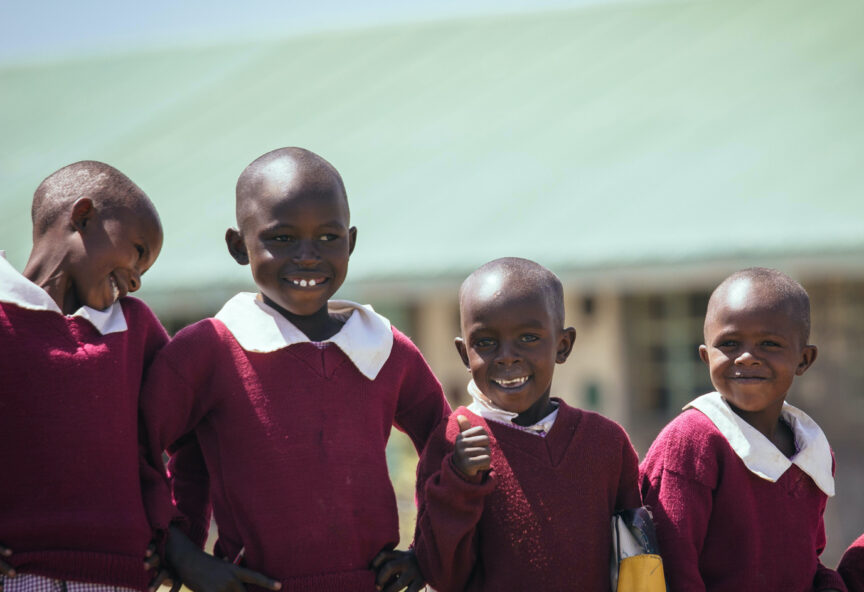 Four school children in uniform