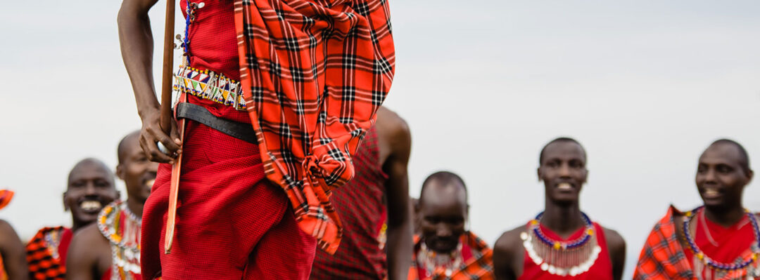 a maasai man performing a renewal ceremony dance