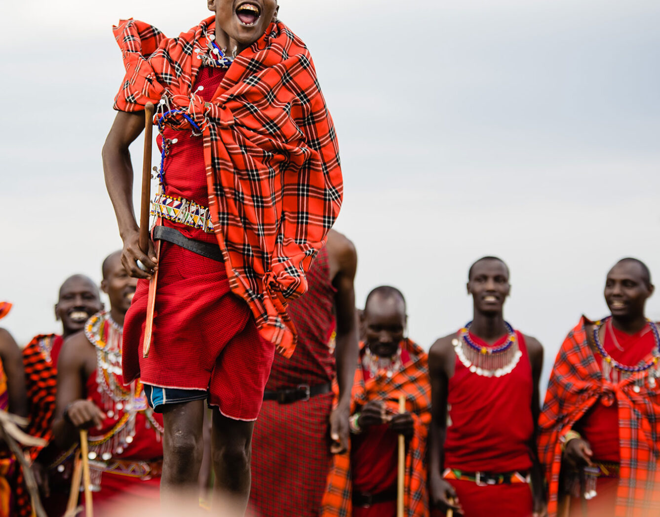 a maasai man performing a renewal ceremony dance