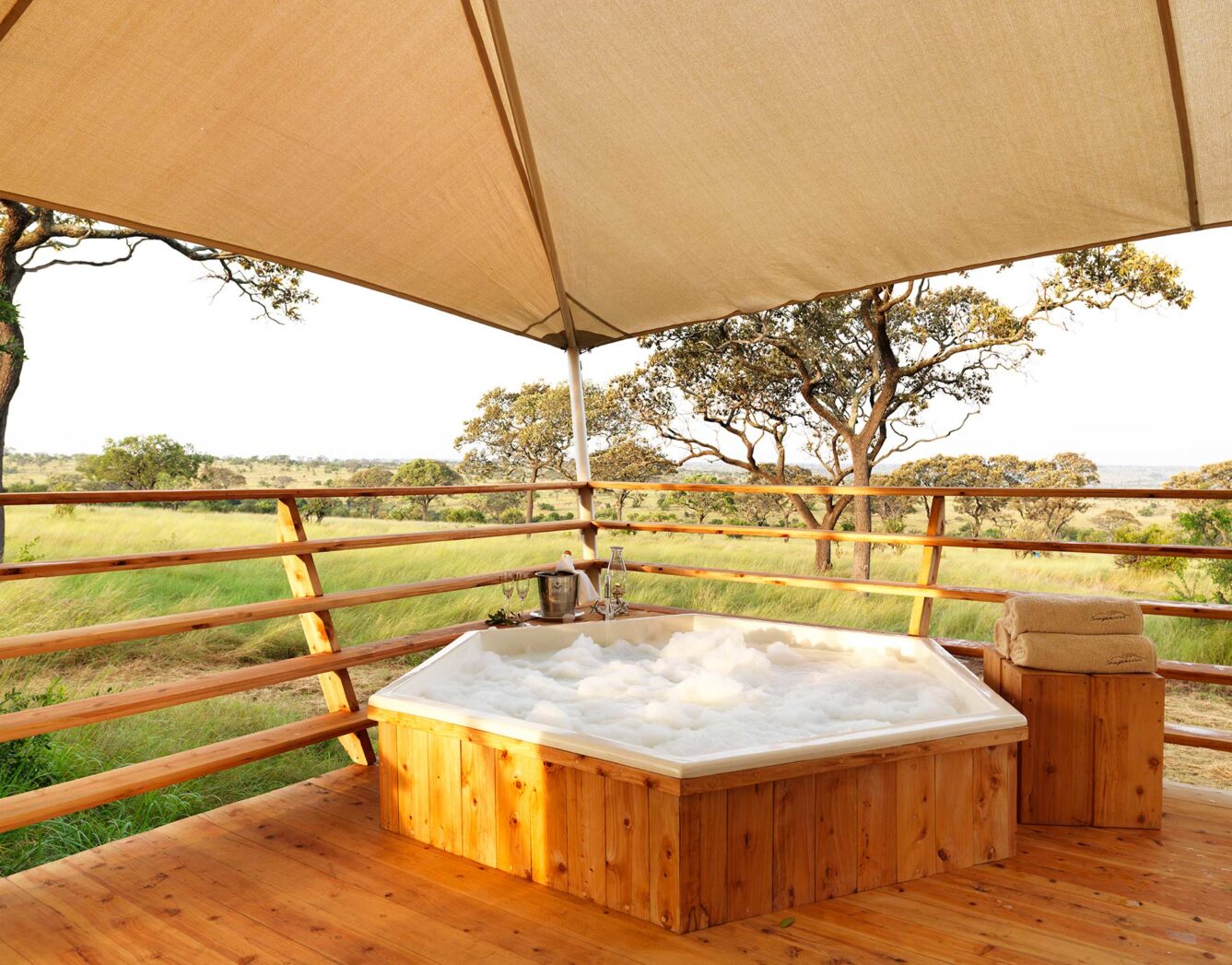 A bubbling hot tub on the tent deck