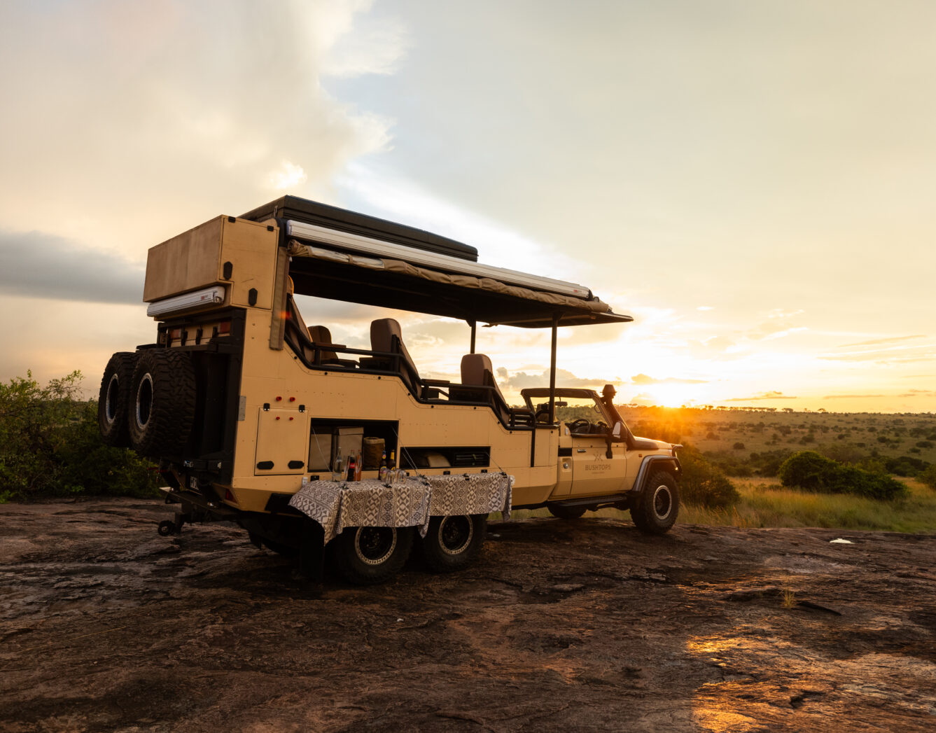 safari vehicle on a rock